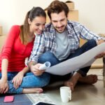 Movers reviewing a moving plan with a customer