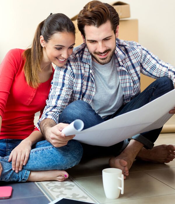 Movers reviewing a moving plan with a customer