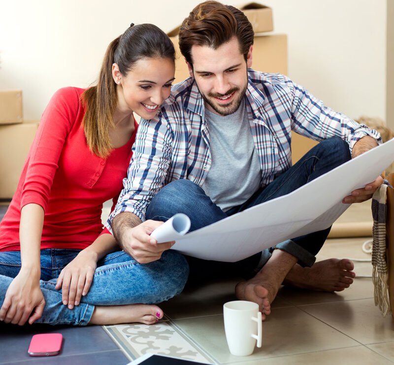 Movers reviewing a moving plan with a customer